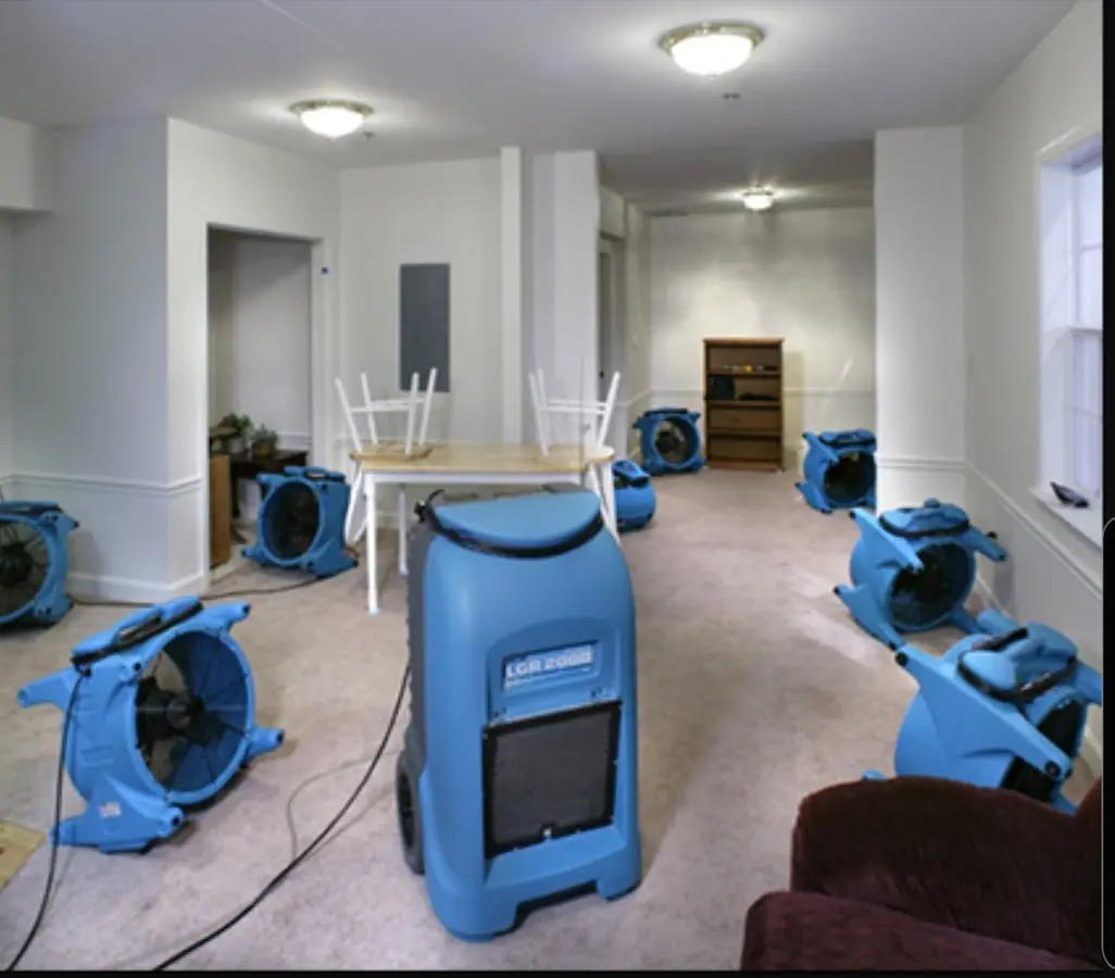 Air movers and dehumidifier setup for Water Damage Restoration in Alton